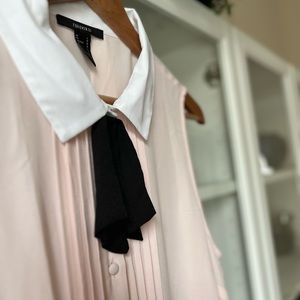 Baby pink sleeveless blouse with black tie